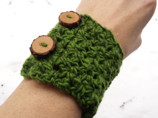 Detailed image 1 of pine forest wrist warmer in green