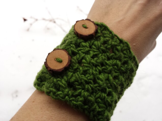 Detailed image 2 of pine forest wrist warmer in green