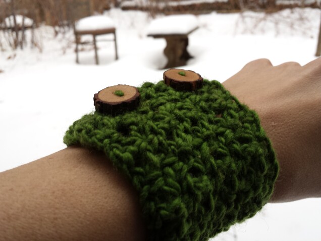 Detailed image 3 of pine forest wrist warmer in green