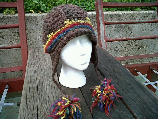 Detailed image 1 of brown earflaps with rainbow beanie hat