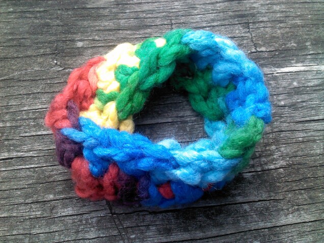 Detailed image 1 of rainbow Mobius strip bracelet